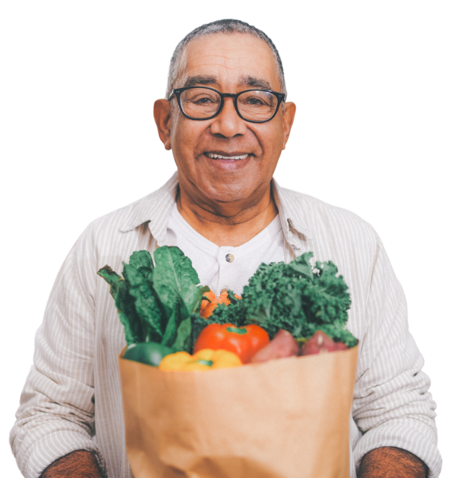 Senior man in glasses holding a bag of groceries